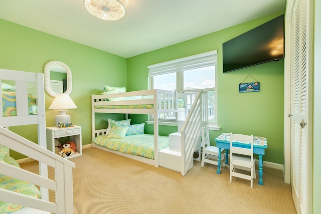 bedroom with light colored carpet