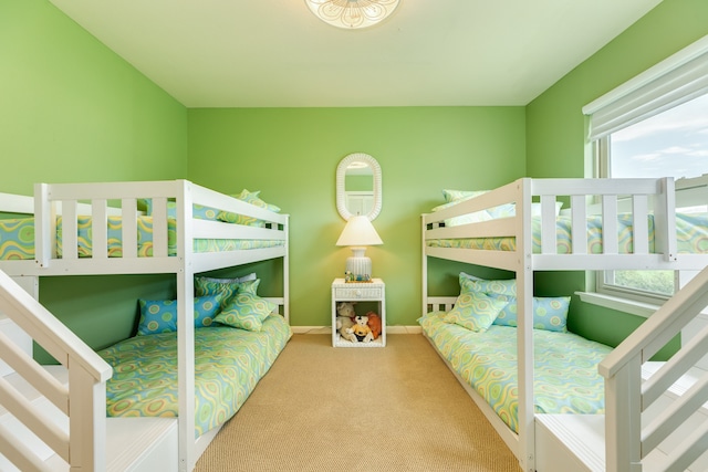 carpeted bedroom featuring multiple windows