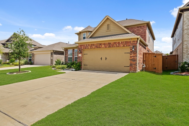 view of front of house featuring a garage and a front yard