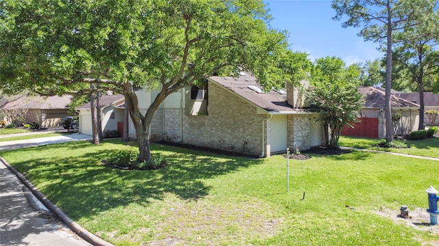 view of front of house with a front yard and a garage