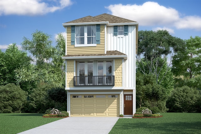 view of front of home featuring a front yard and a garage