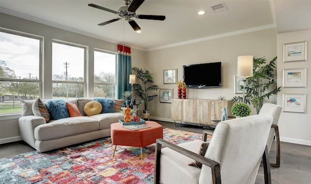 living room featuring hardwood / wood-style flooring, ceiling fan, and ornamental molding