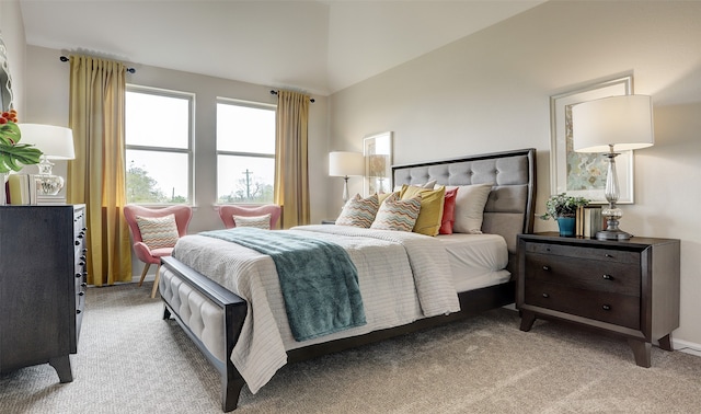 carpeted bedroom with vaulted ceiling