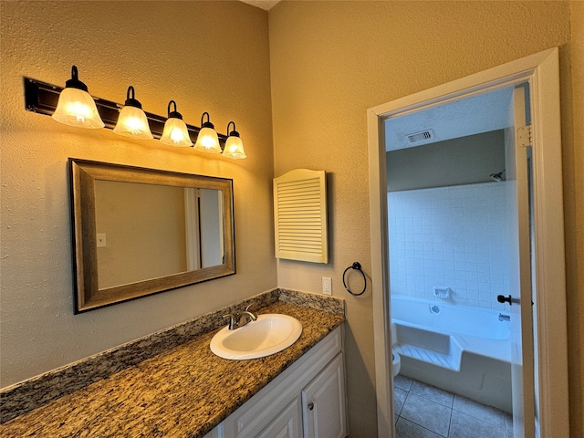 full bathroom with vanity, toilet, shower / washtub combination, and tile patterned floors