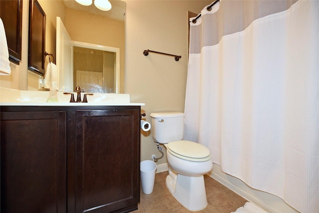 full bathroom featuring shower / bath combo, toilet, tile patterned floors, and vanity