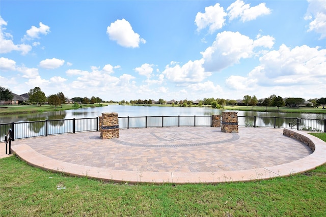 view of patio with a water view