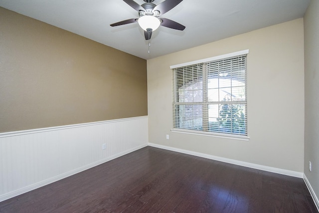 empty room featuring dark hardwood / wood-style floors and ceiling fan