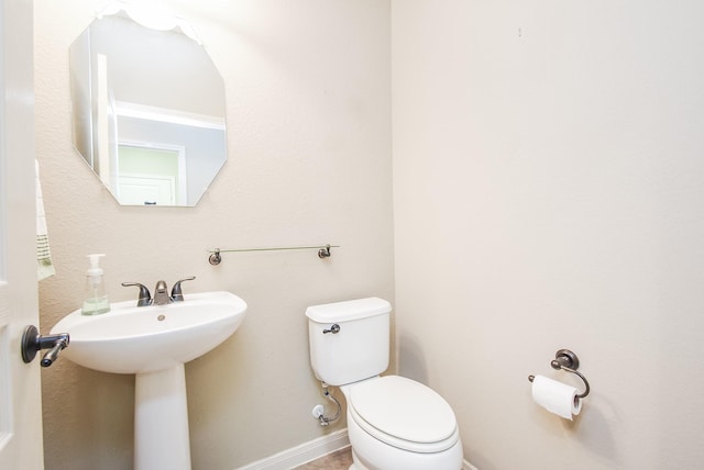 bathroom featuring toilet