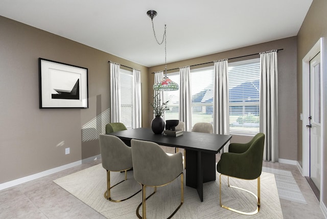 dining area with light tile patterned flooring