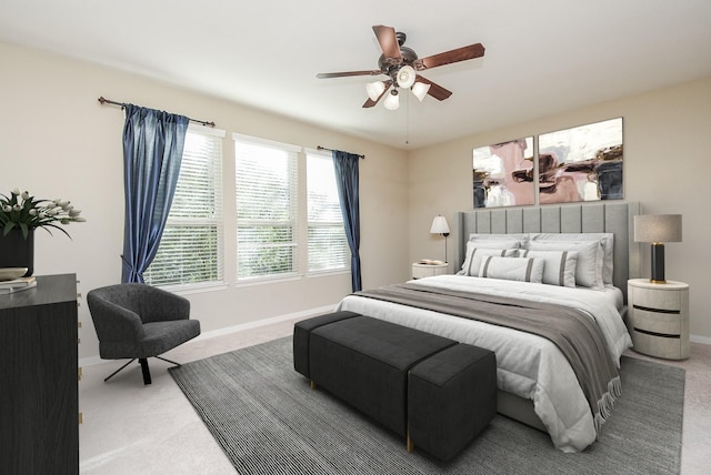 bedroom with ceiling fan and carpet flooring