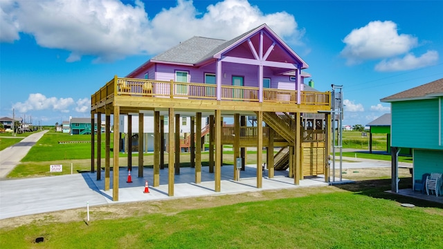 rear view of house with a yard