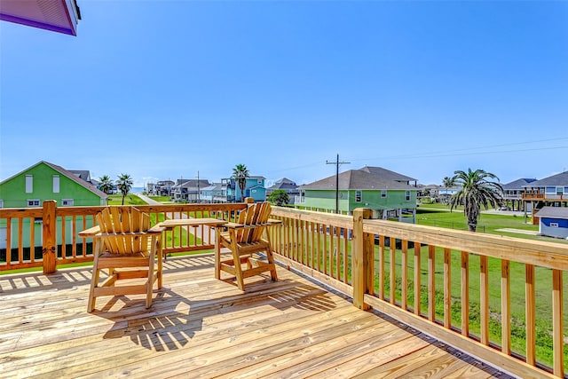 wooden deck with a yard