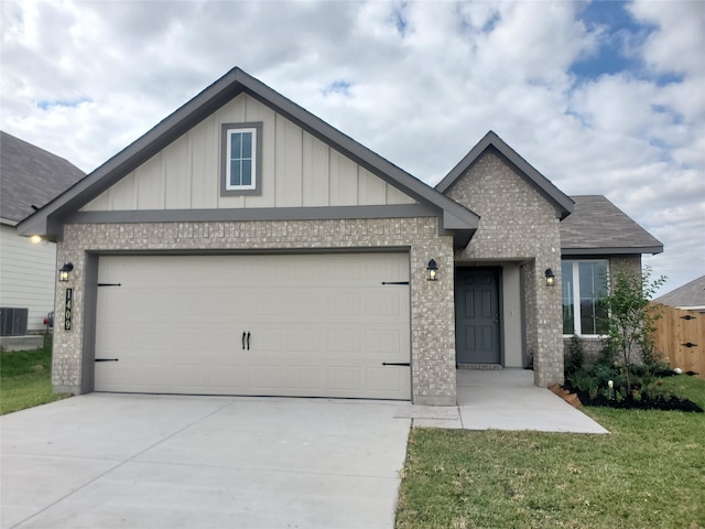 view of front of home featuring a front yard and a garage