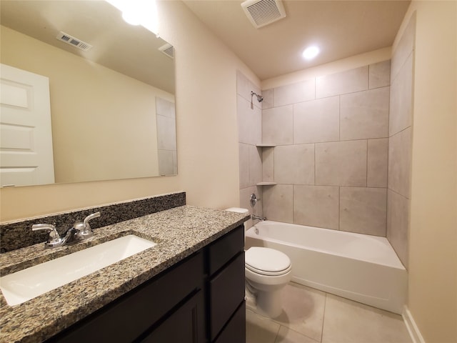 full bathroom featuring toilet, vanity, tile patterned floors, and tiled shower / bath