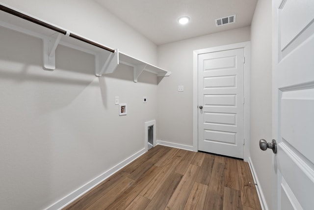 1409 Whitney Ln, Brenham, TX 77833 - washroom with electric dryer hookup, wood finished floors, visible vents, and laundry area