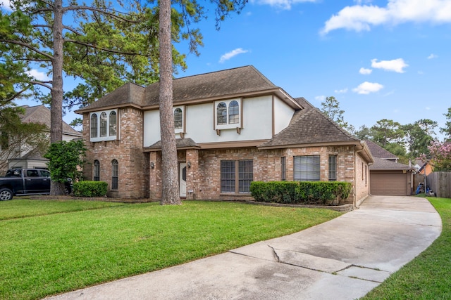 view of front of home featuring a garage and a front yard