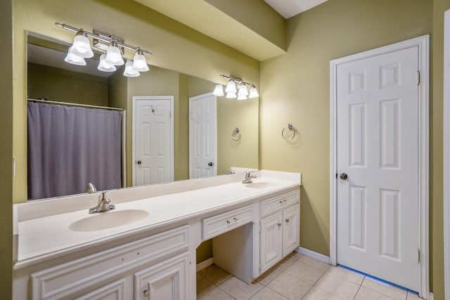 bathroom featuring tile patterned flooring and vanity