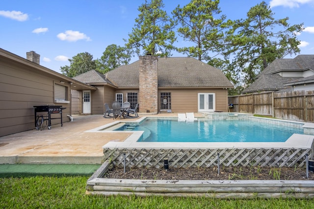 view of pool featuring french doors and a patio