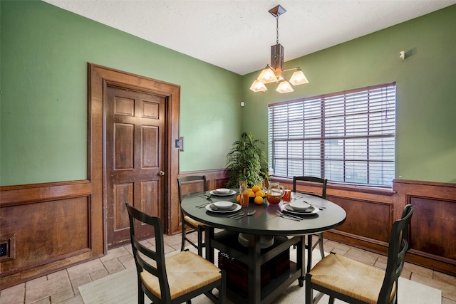 dining space with a chandelier