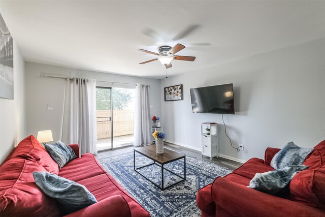 living room with ceiling fan and wood-type flooring