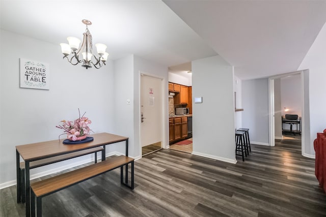 dining area with a chandelier and dark hardwood / wood-style flooring