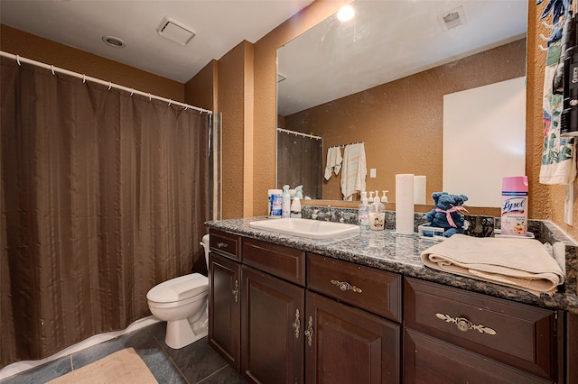 bathroom featuring vanity, tile patterned flooring, toilet, and a shower with shower curtain