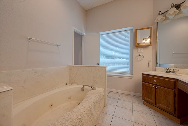 bathroom with vanity, tile patterned flooring, and a bath