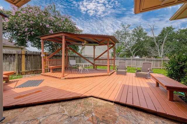 wooden terrace featuring a gazebo