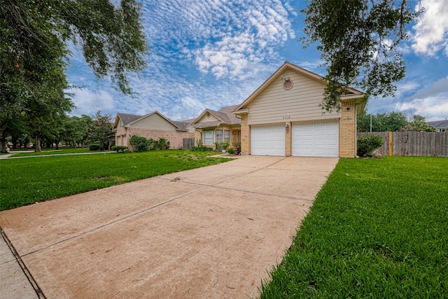 view of front of property with a garage and a front yard