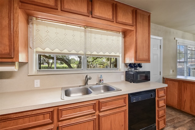 kitchen with black appliances, sink, and a wealth of natural light