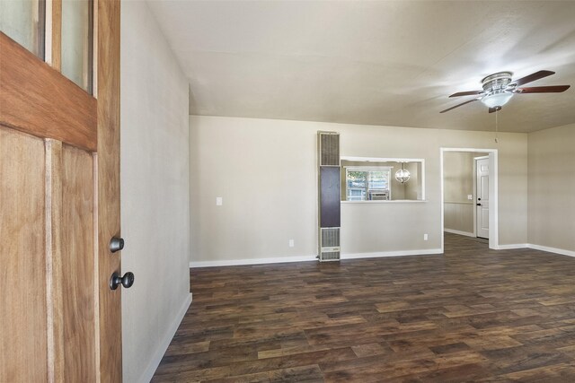 spare room featuring ceiling fan and dark hardwood / wood-style floors