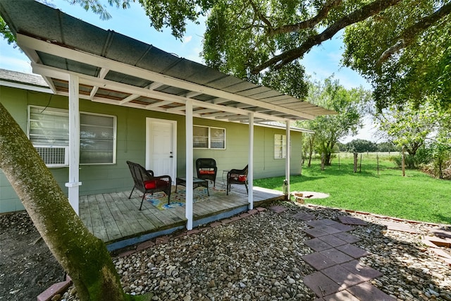 exterior space with a lawn, a pergola, and a deck