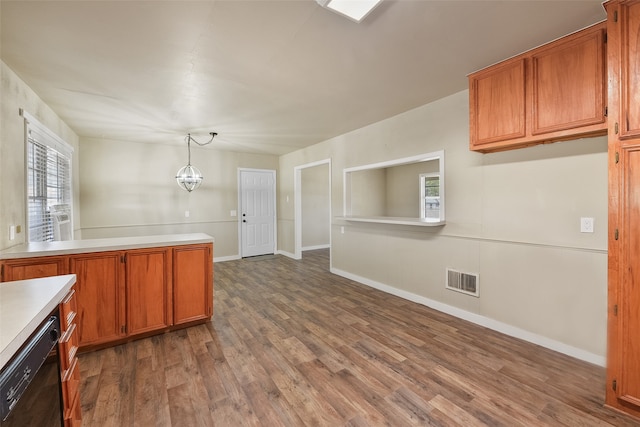 kitchen with pendant lighting, dishwasher, a notable chandelier, and dark hardwood / wood-style flooring