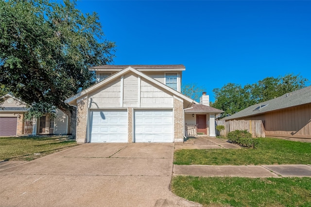 view of property featuring a front yard and a garage