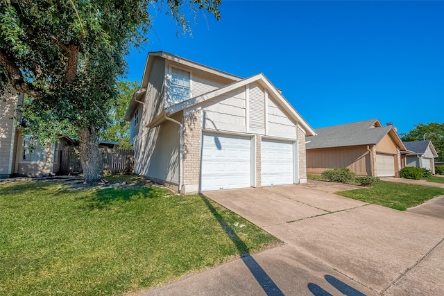 view of side of property with a garage and a lawn