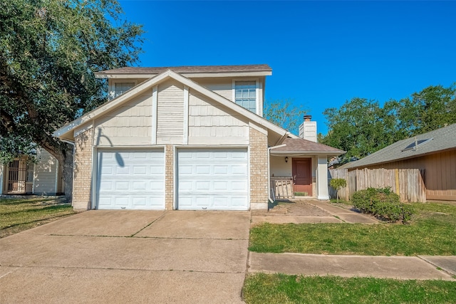 view of front property with a front yard and a garage