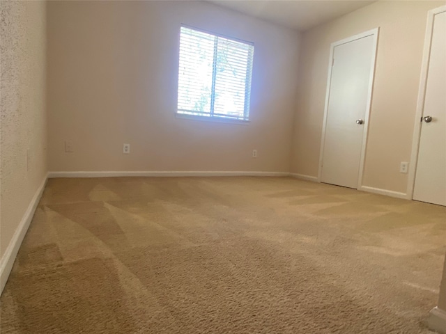 spare room featuring carpet