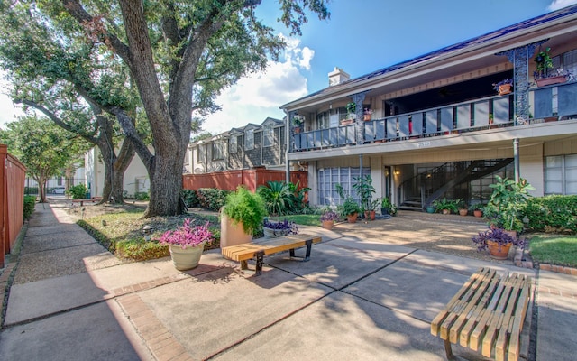 view of home's community with a patio area