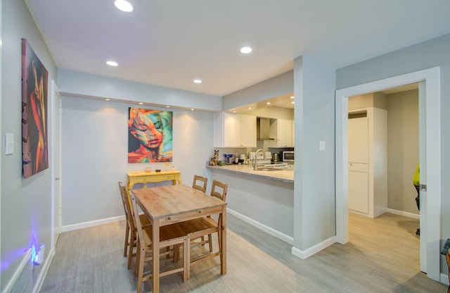 2575 Marilee Ln Unit 1, Houston, TX 77057 - dining room with light wood-type flooring and recessed lighting