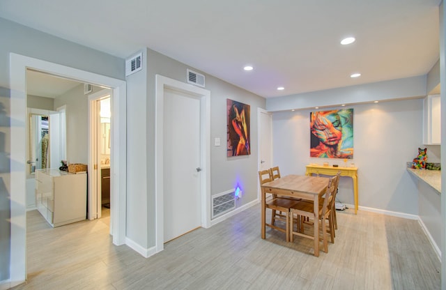 dining space featuring light hardwood / wood-style flooring