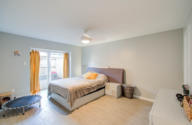 bedroom with light hardwood / wood-style floors and ceiling fan