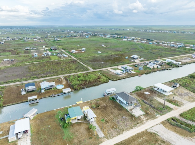 drone / aerial view featuring a rural view and a water view