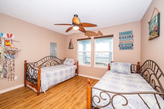 bedroom featuring hardwood / wood-style floors and ceiling fan