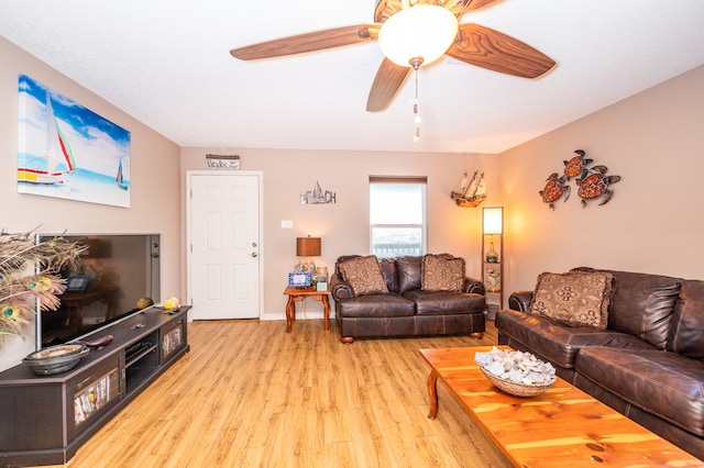 living room with ceiling fan and light hardwood / wood-style floors