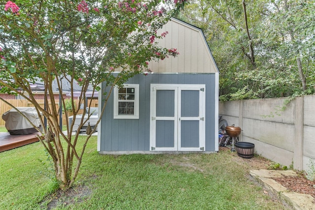 view of outbuilding with a yard