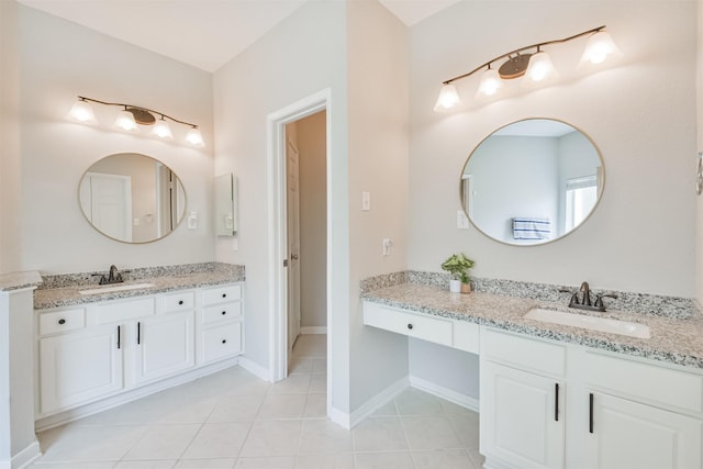 bathroom featuring tile patterned flooring and vanity