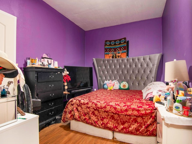 bedroom with wood-type flooring