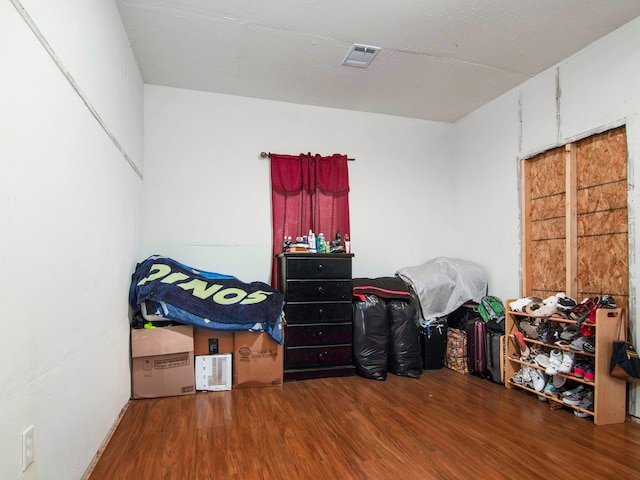 bedroom with wood-type flooring