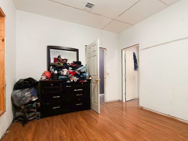 bedroom with wood-type flooring