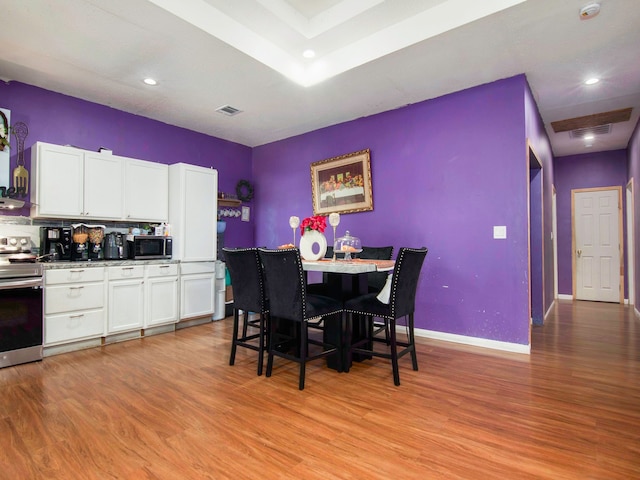 dining area with light hardwood / wood-style flooring